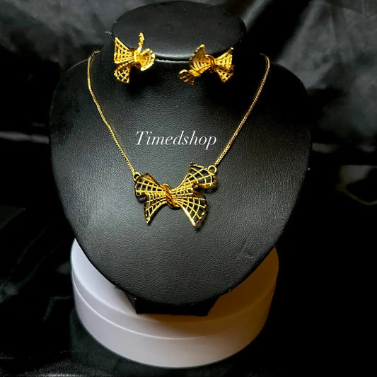 Parure “Nœud d’Or” – Élégance intemporelle
